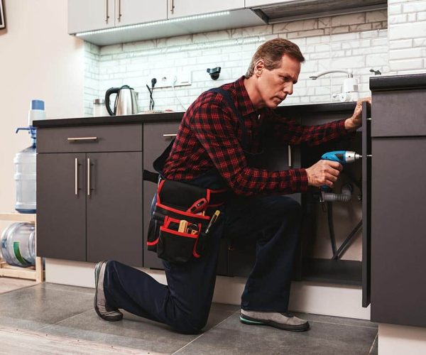 handyman-at-work-repairing-kitchen-shelves-by-per-resize.jpg
